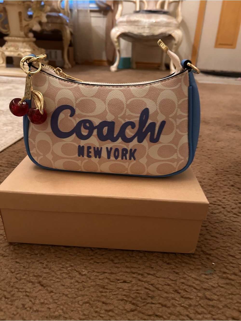 Coach Beige Signature Mini Bag with Blue Trim and Cherry Charm